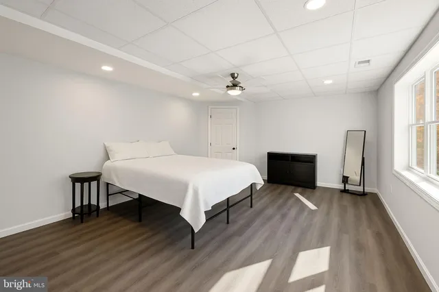 a bathroom with a sink toilet and a mirror