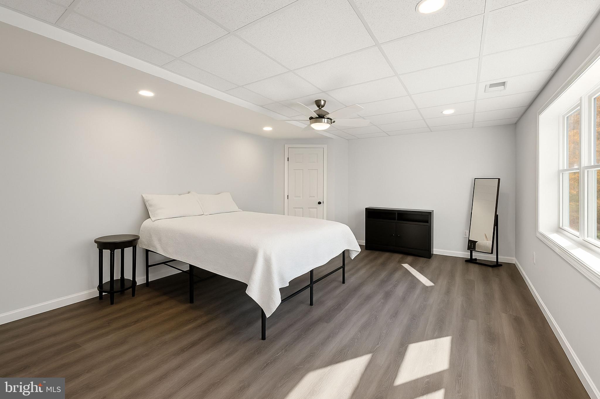 200 Mile Ridge Estates Strasburg, VA 22641 - Photo 12 of 18 a spacious bedroom with a bed and a table