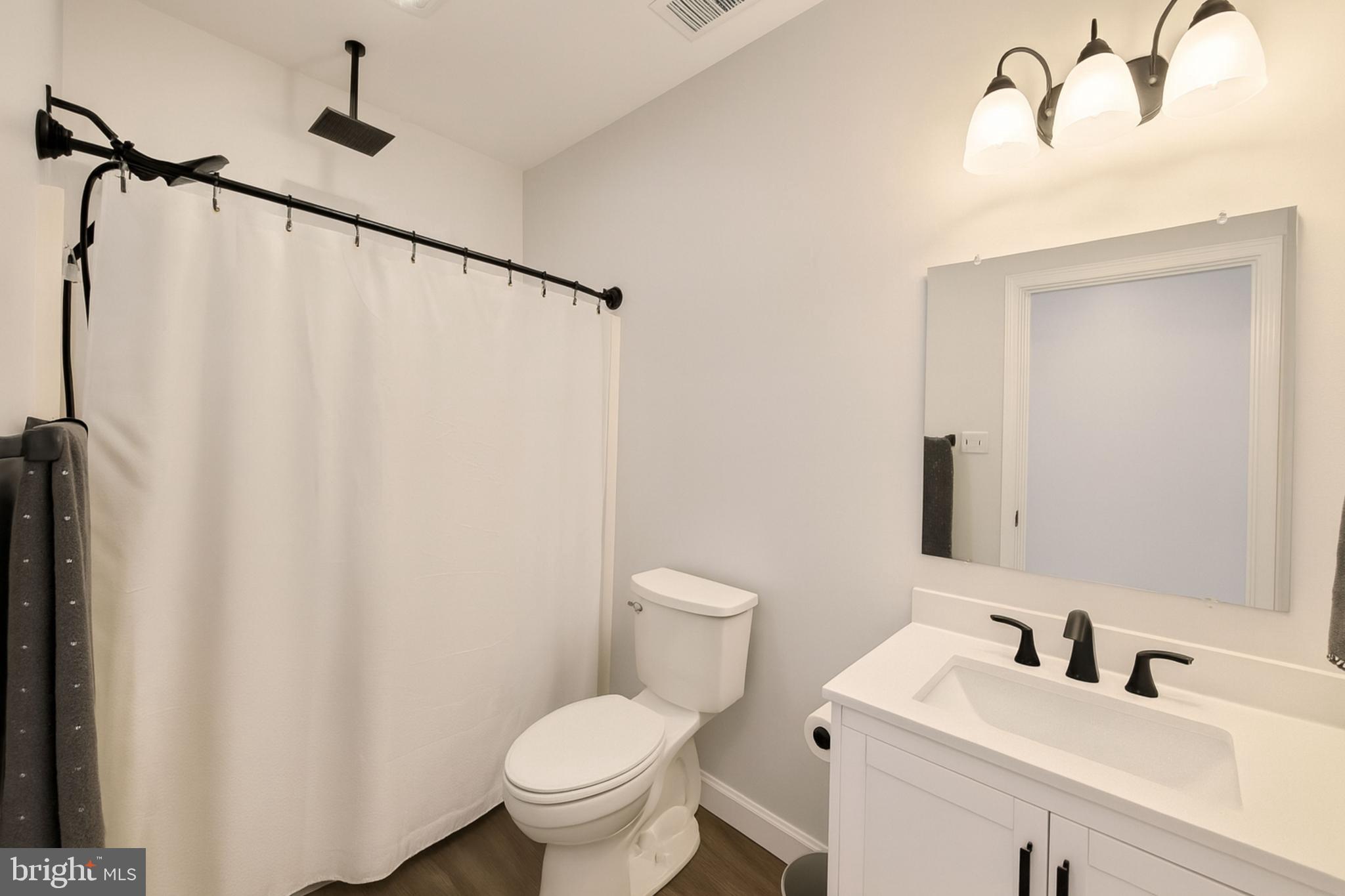 200 Mile Ridge Estates Strasburg, VA 22641 - Photo 13 of 18 a bathroom with a sink toilet and a mirror