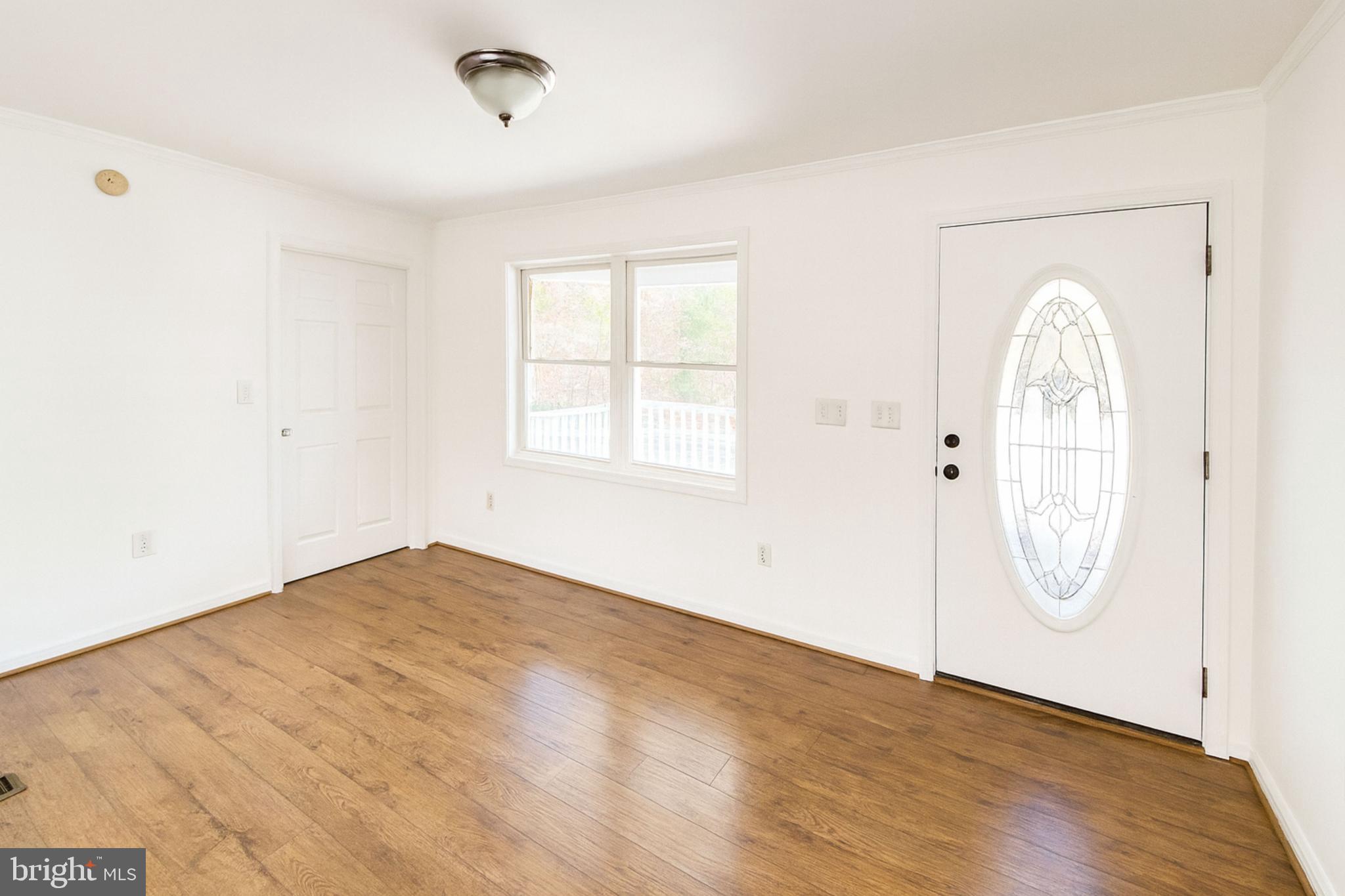 200 Mile Ridge Estates Strasburg, VA 22641 - Photo 4 of 18 an empty room with wooden floor and windows
