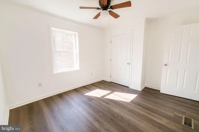 a bathroom with a sink mirror and toilet