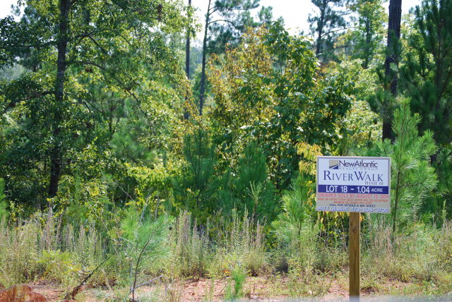 Lot 18 Rivers Edge Drive, Unit 18 Forsyth, GA 31029 - Photo 1 of 1 a sign on the side of a road