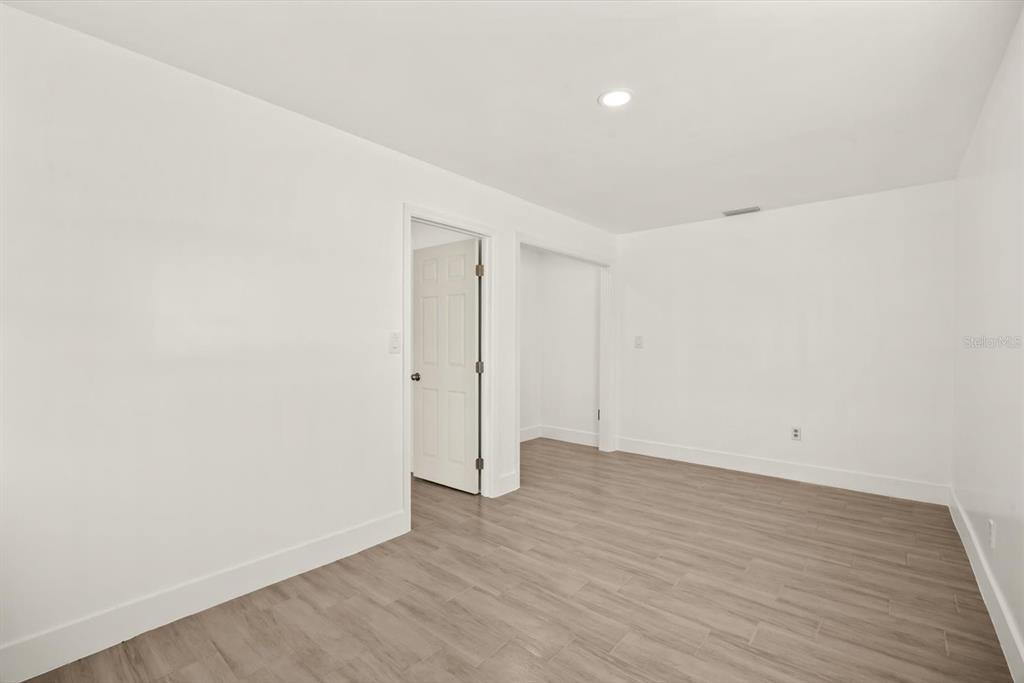 31300 Highway 441 Okeechobee, FL 34972 - Photo 19 of 33 a view of an empty room with wooden floor