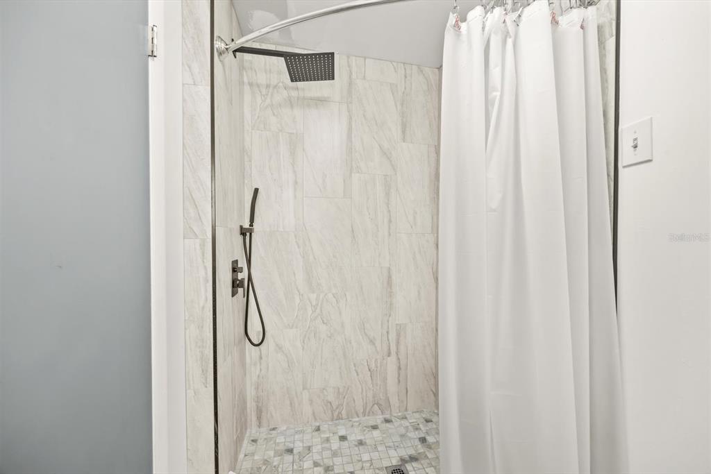 31300 Highway 441 Okeechobee, FL 34972 - Photo 22 of 33 a bathroom with a shower