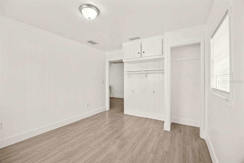31300 Highway 441 Okeechobee, FL 34972 - Photo 24 of 33 an empty room with wooden floor