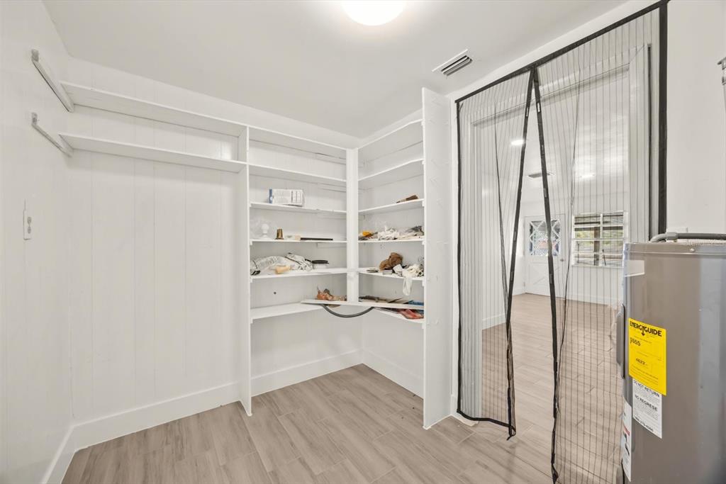 31300 Highway 441 Okeechobee, FL 34972 - Photo 27 of 33 a view of walk in closet with empty racks