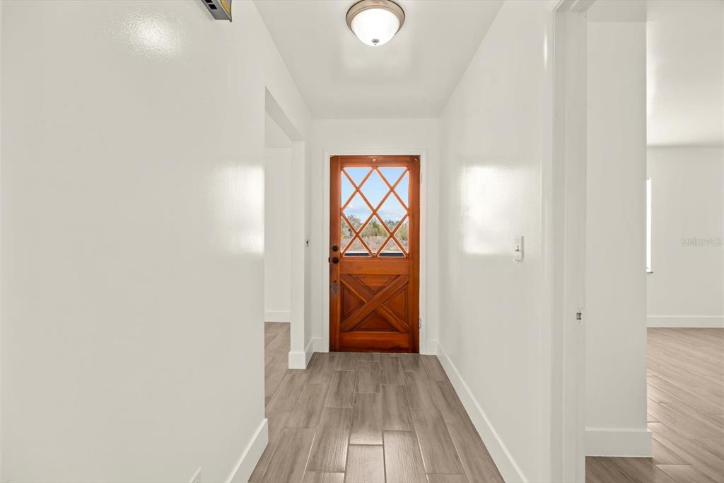 31300 Highway 441 Okeechobee, FL 34972 - Photo 4 of 33 a view of hallway with wooden floor