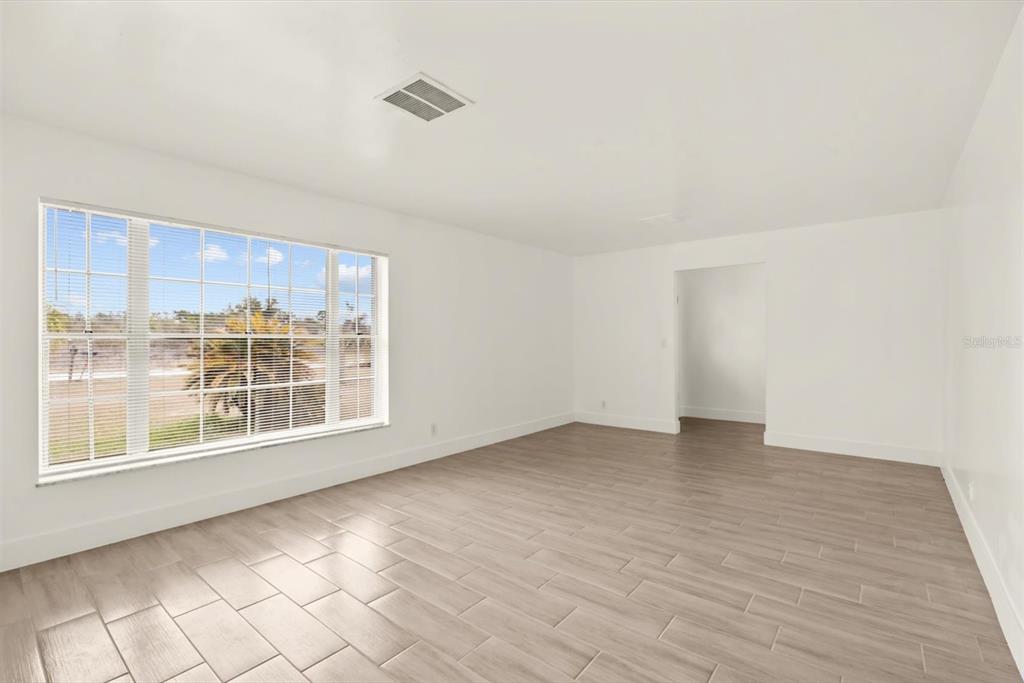 31300 Highway 441 Okeechobee, FL 34972 - Photo 6 of 33 a view of an empty room with a window