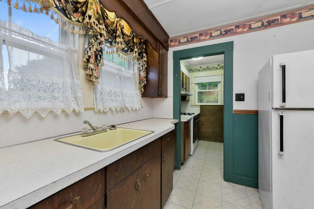 15 Cottage Avenue Danvers, MA 01923 - Photo 13 of 24 a bathroom with a sink and a mirror