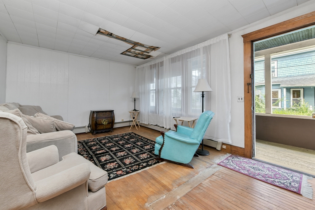 15 Cottage Avenue Danvers, MA 01923 - Photo 3 of 24 a living room with furniture and a couch