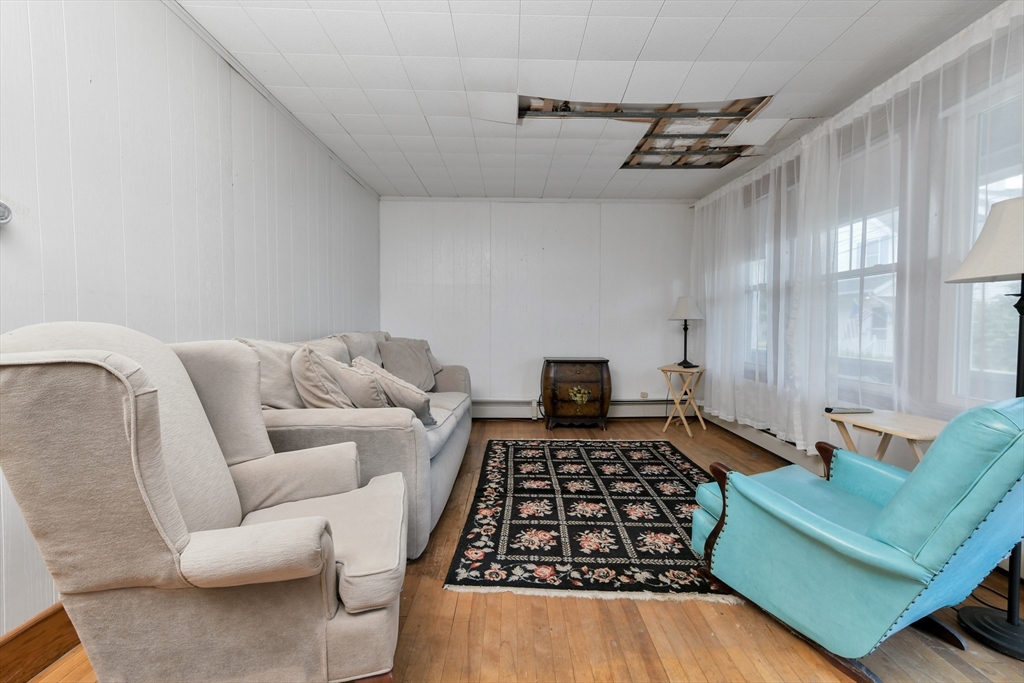 15 Cottage Avenue Danvers, MA 01923 - Photo 4 of 24 a living room with furniture and a rug