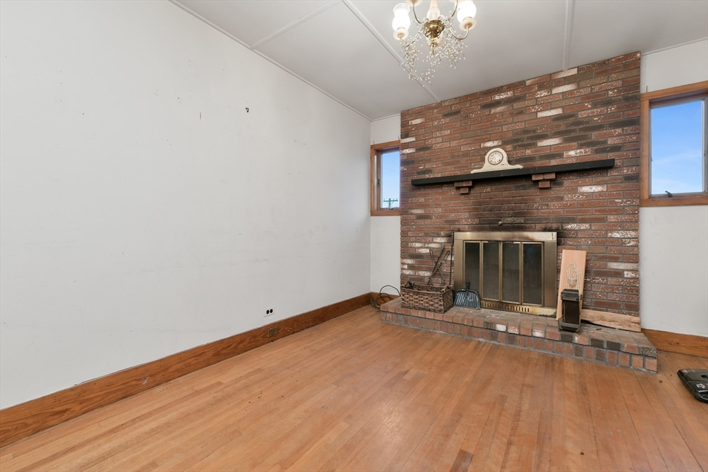 15 Cottage Avenue Danvers, MA 01923 - Photo 7 of 24 a view of a livingroom with a fireplace