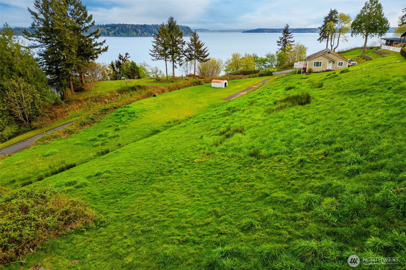 9214 163rd Avenue Southwest Longbranch, WA 98351 - Photo 15 of 33 a view of yard with swimming pool and green space