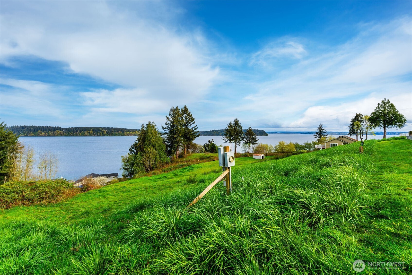 9214 163rd Avenue Southwest Longbranch, WA 98351 - Photo 18 of 33 a view of a lake with a big yard
