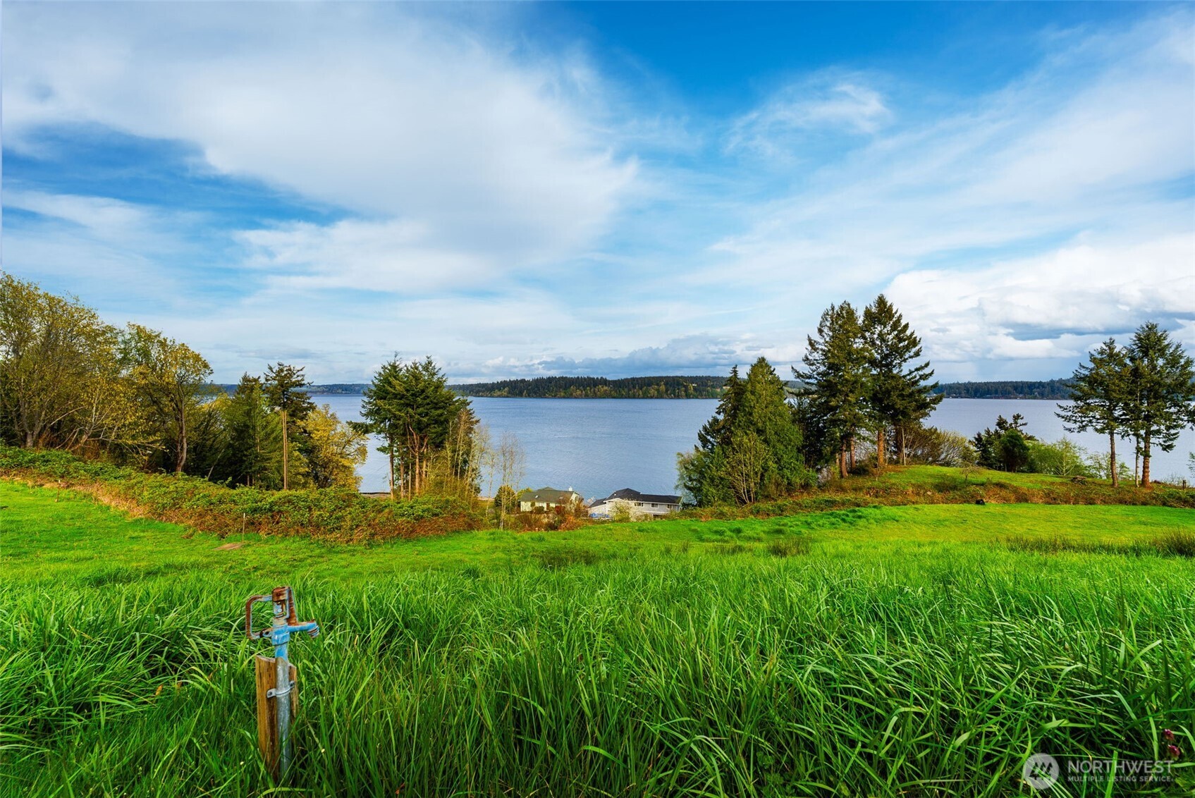 9214 163rd Avenue Southwest Longbranch, WA 98351 - Photo 19 of 33 a view of a garden with a building in the background