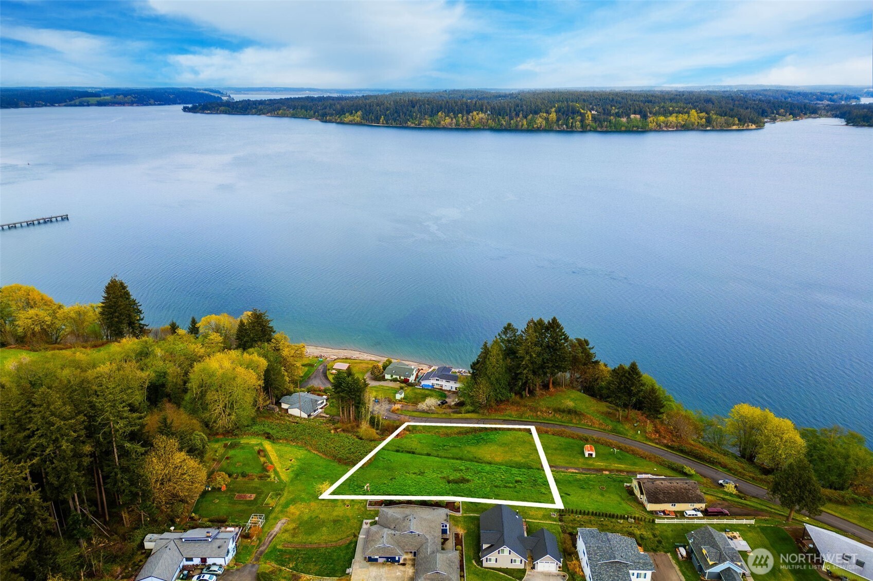 9214 163rd Avenue Southwest Longbranch, WA 98351 - Photo 25 of 33 a picture of a small space with water heater and racks on the wall