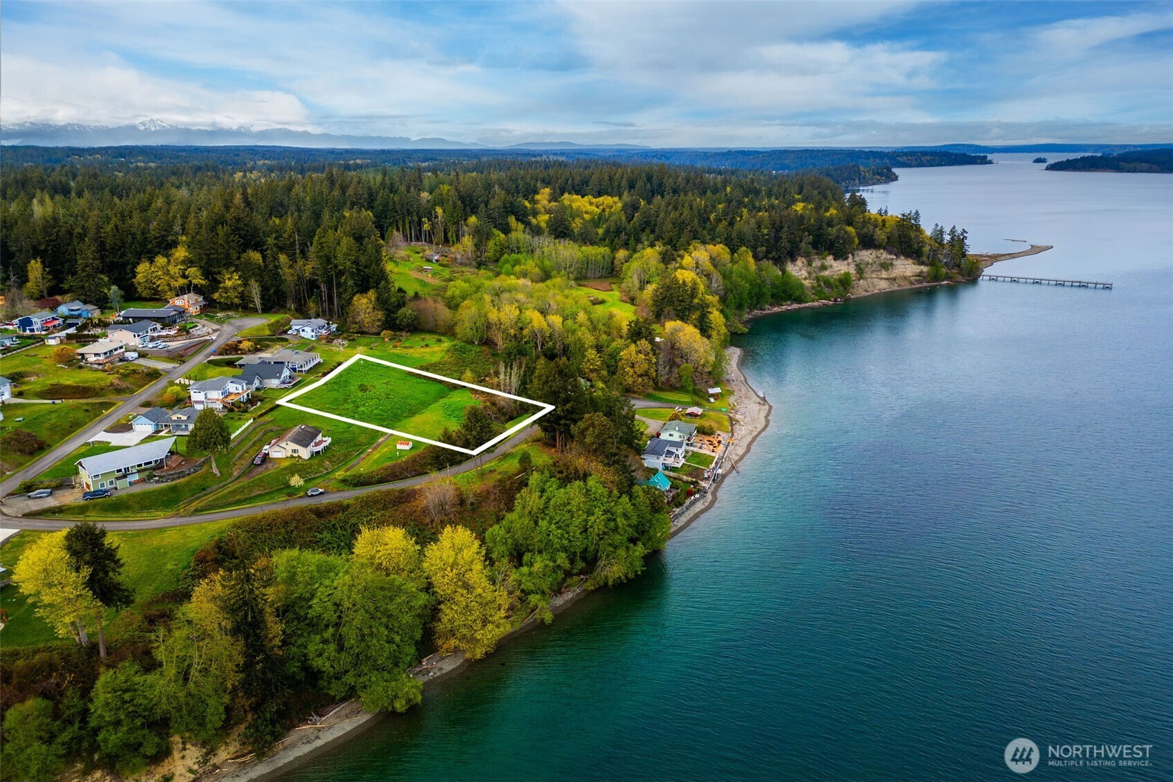 9214 163rd Avenue Southwest Longbranch, WA 98351 - Photo 3 of 33 a view of a lake with a mountain