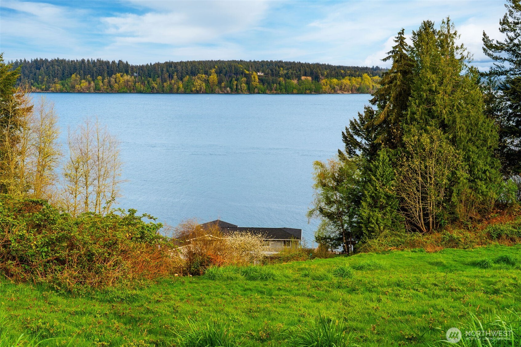 9214 163rd Avenue Southwest Longbranch, WA 98351 - Photo 5 of 33 a view of a lake with houses in the back
