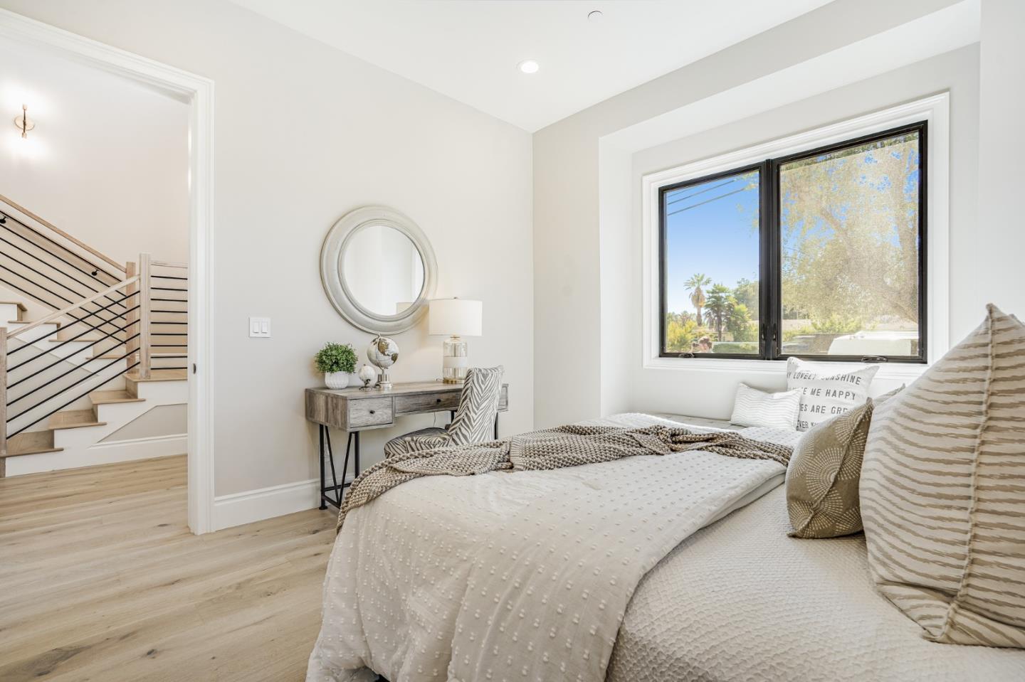1950 Quito Road San Jose, CA 95130 - Photo 19 of 46 a bedroom with a bed a mirror and a window