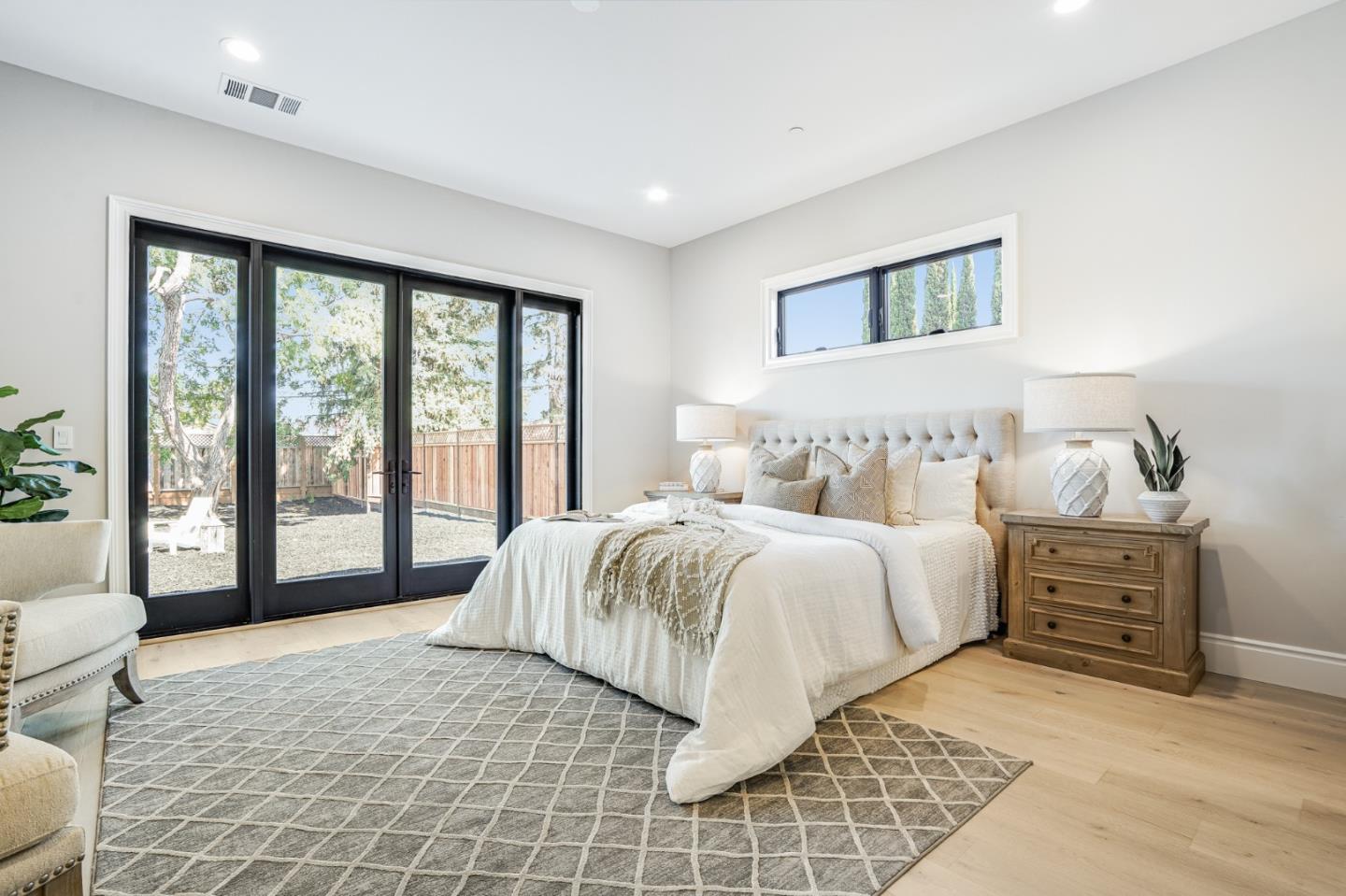 1950 Quito Road San Jose, CA 95130 - Photo 22 of 46 a bedroom with a large bed and a large window