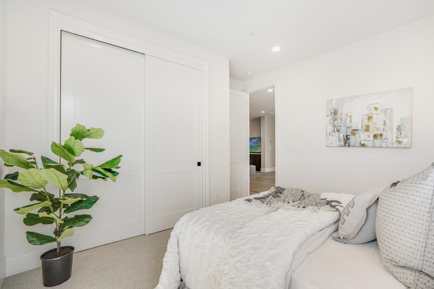 1950 Quito Road San Jose, CA 95130 - Photo 33 of 46 a bedroom with a bed and a potted plant