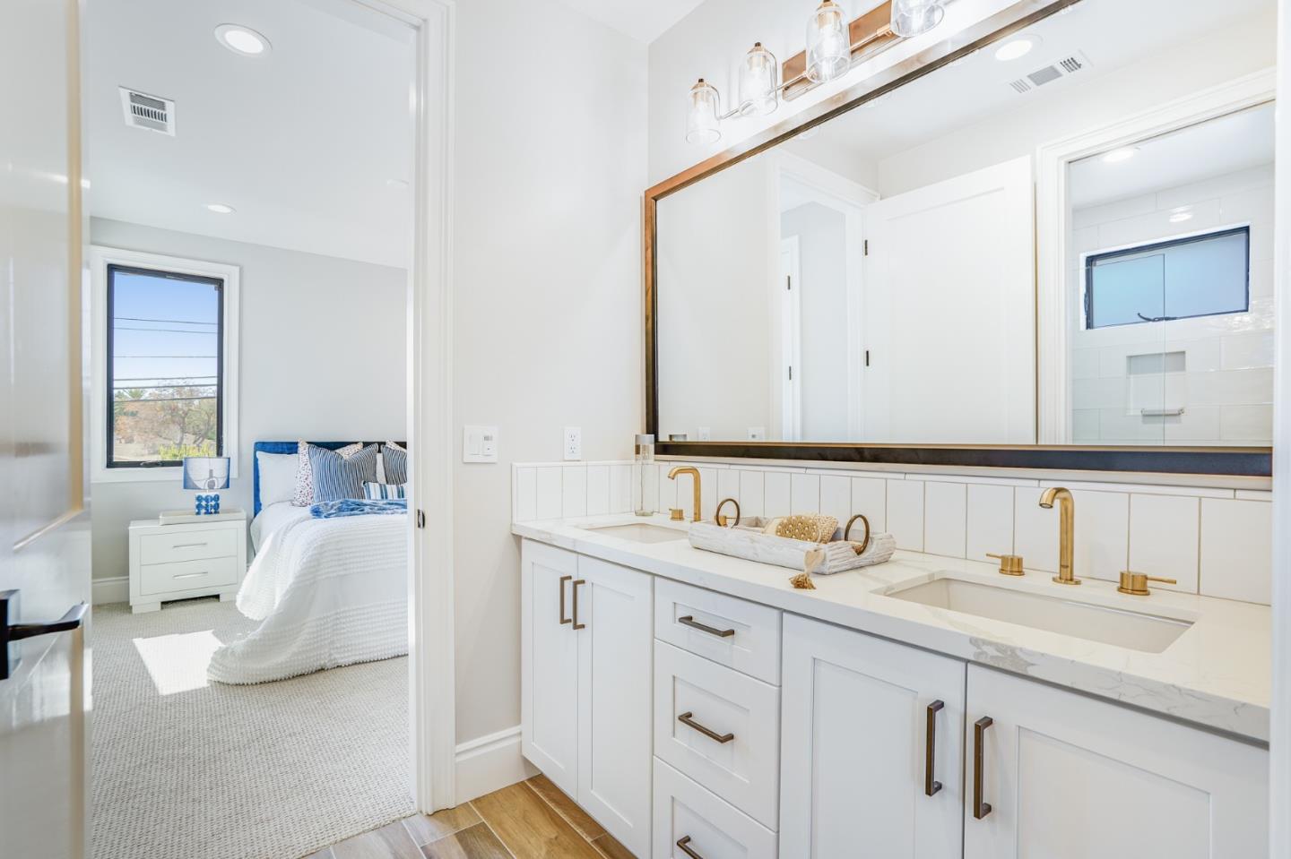 1950 Quito Road San Jose, CA 95130 - Photo 36 of 46 a en suite bathroom with a double vanity sink and mirror