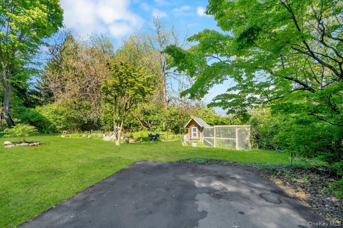 7 Rutledge Road Valhalla, NY 10595 - Photo 32 of 37 Expansive green lawn with mature trees and a dedicated outbuilding
