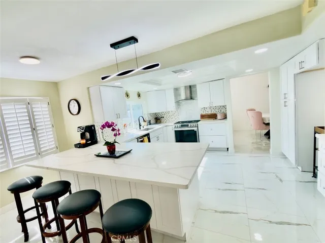 a spacious bathroom with a double vanity sink and a mirror