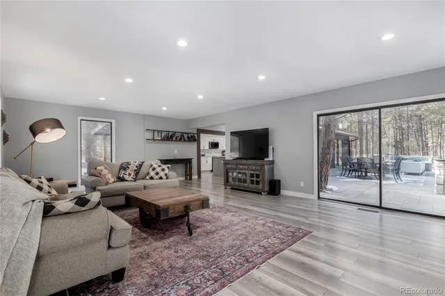 a view of a dining room with furniture and window