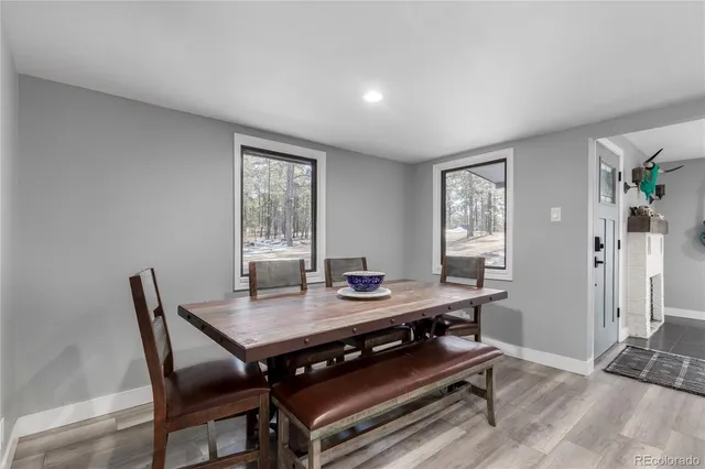 a kitchen with stainless steel appliances granite countertop a stove top oven a sink and cabinets