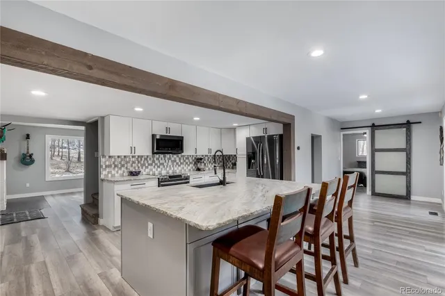 a bed room with a bed and a chair