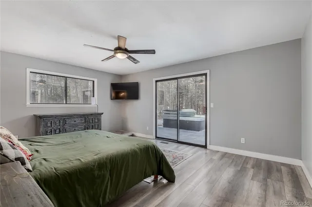 a bathroom with a double vanity sink a mirror and a bathtub