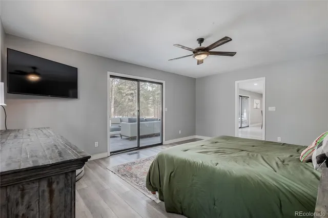 a spacious bathroom with a sink double vanity granite and a mirror