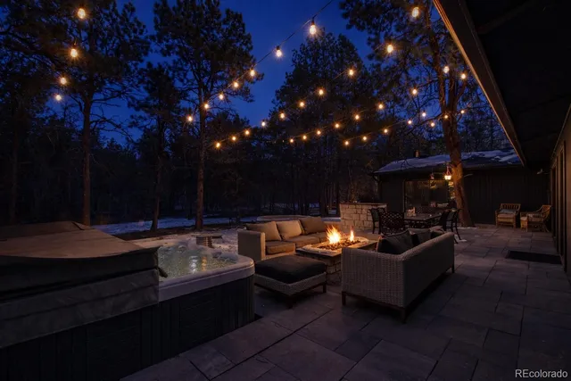 a outdoor living space with patio furniture and a fireplace