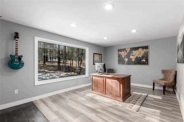 a bedroom with a bed a couch and dresser