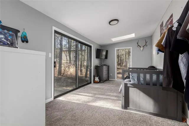 a view of a patio with couches and a fire pit