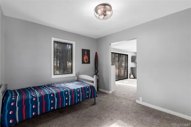 a view of a patio with table and chairs