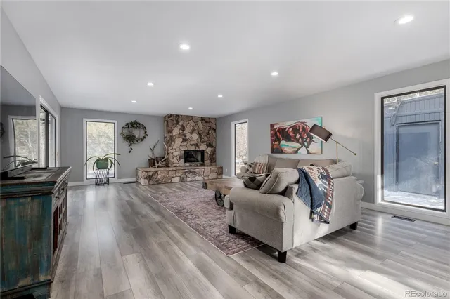 a bedroom with a bed and a fireplace