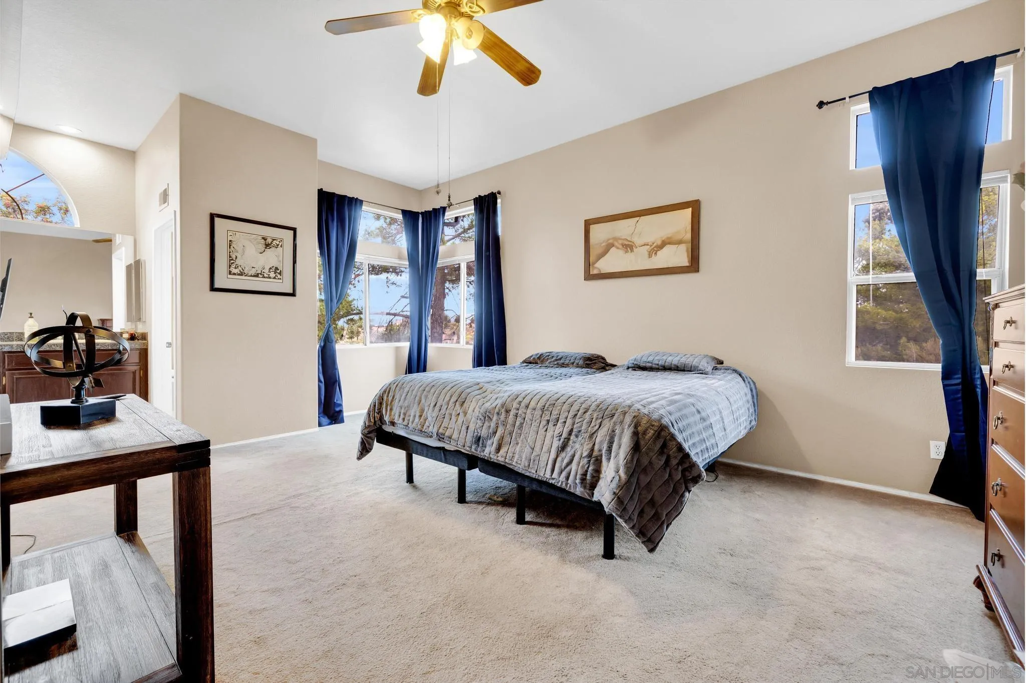 1019 Bremen Way Alpine, CA 91901 - Photo 15 of 68 a spacious bedroom with a bed a couch and a window