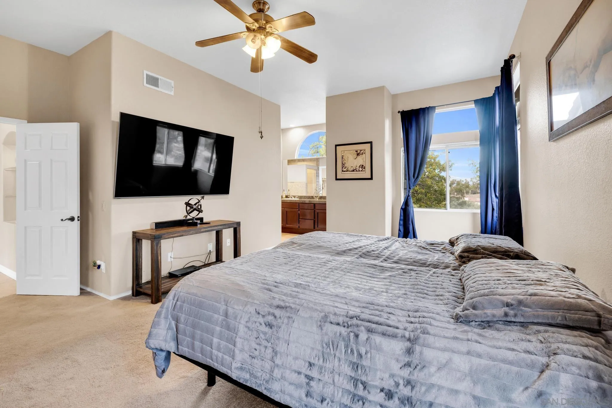 1019 Bremen Way Alpine, CA 91901 - Photo 17 of 68 a bedroom with a bed and a flat screen tv