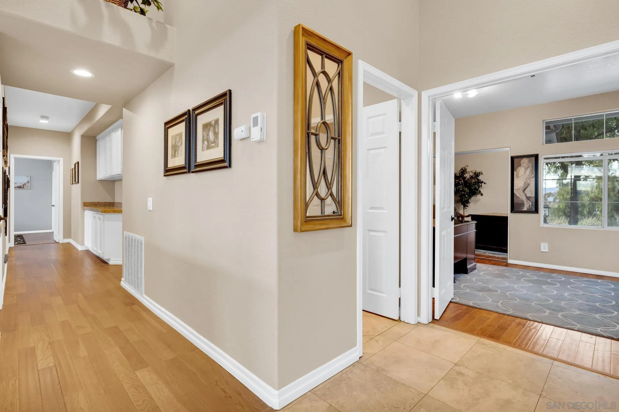 1019 Bremen Way Alpine, CA 91901 - Photo 30 of 68 a view of a hallway with wooden floor and a living room