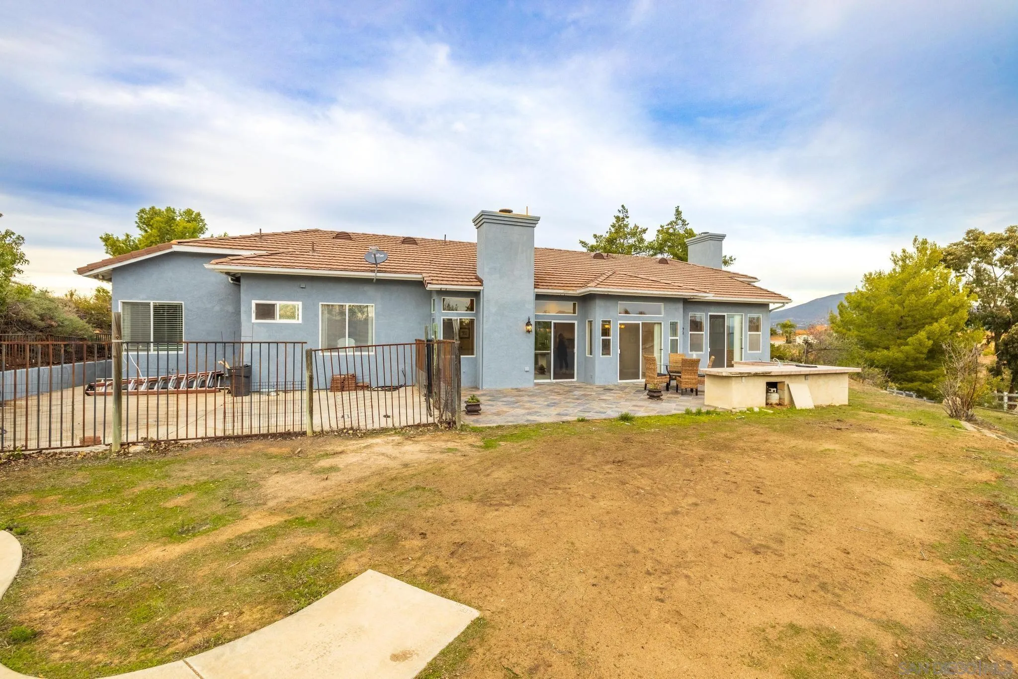 1019 Bremen Way Alpine, CA 91901 - Photo 38 of 68 a front view of a house with a yard