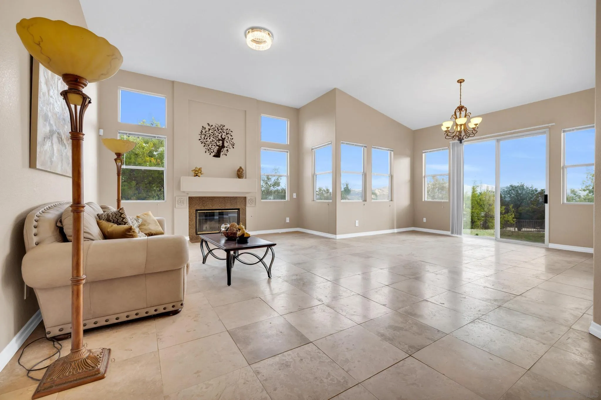 1019 Bremen Way Alpine, CA 91901 - Photo 7 of 68 a living room with furniture a fireplace and a chandelier