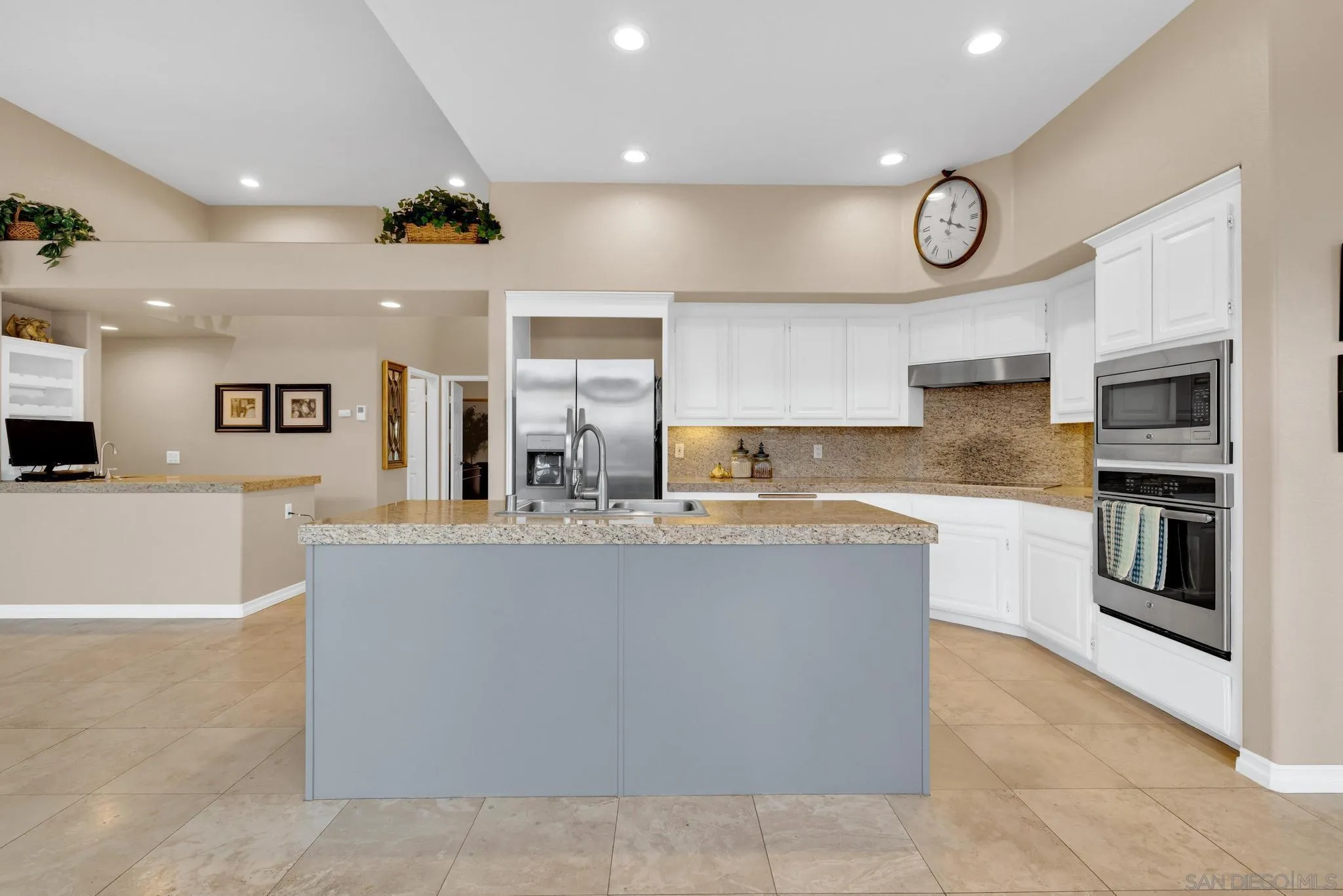 1019 Bremen Way Alpine, CA 91901 - Photo 9 of 68 a large kitchen with stainless steel appliances a large counter top and a stove