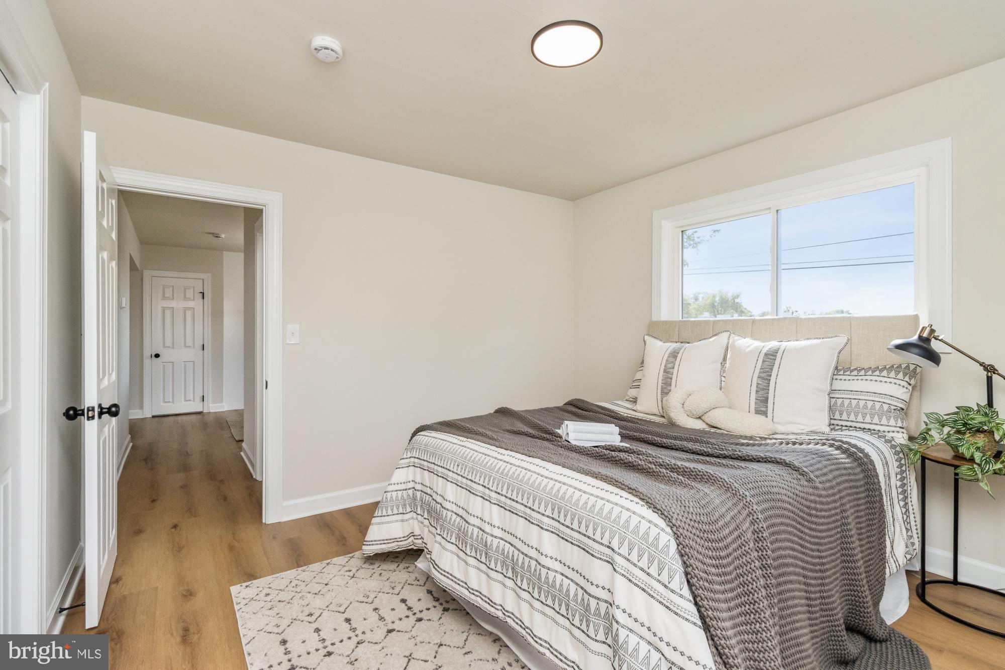 8016 Harris Avenue Parkville, MD 21234 - Photo 20 of 34 a bedroom with a bed and wooden floor