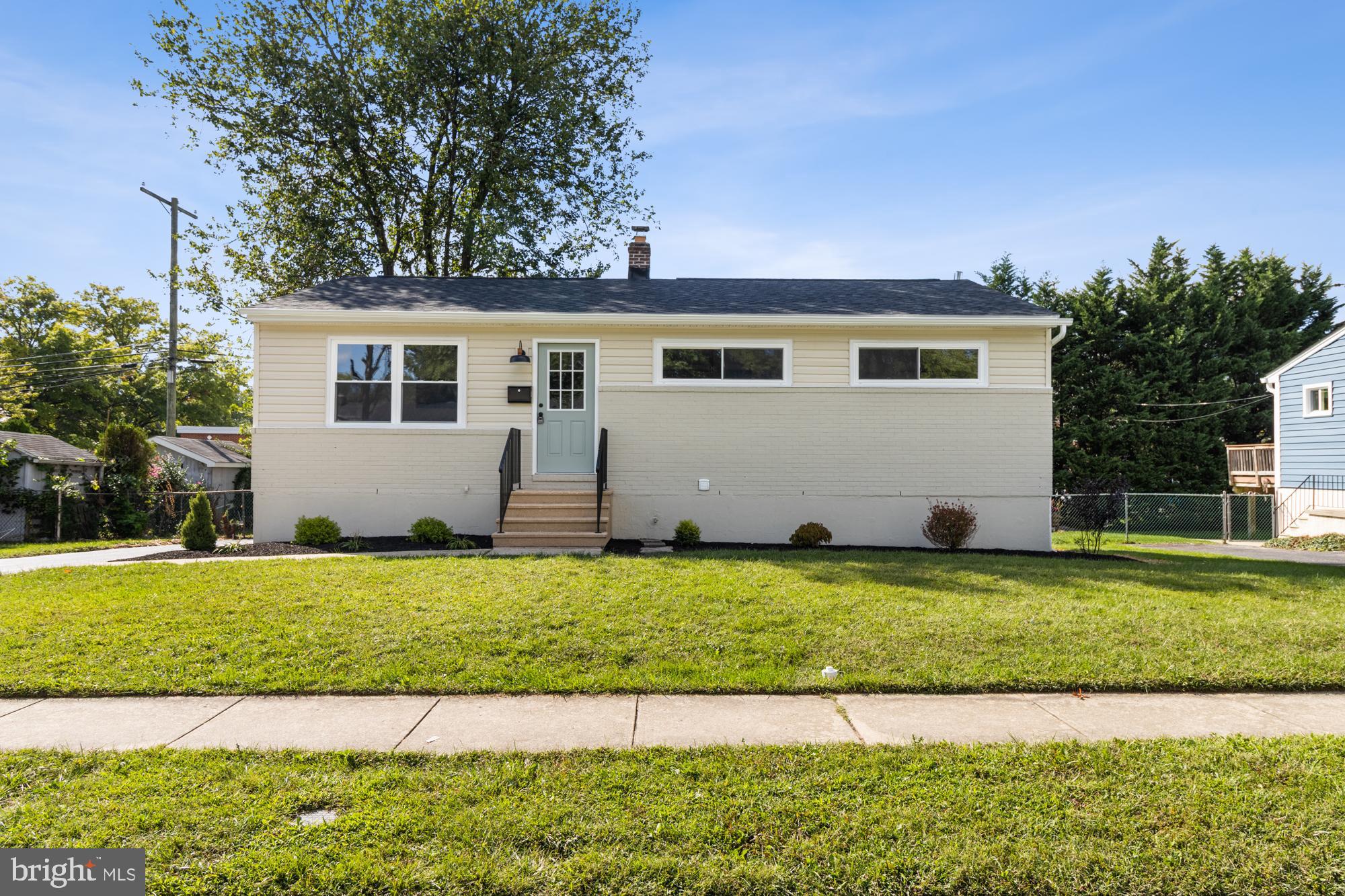 8016 Harris Avenue Parkville, MD 21234 - Photo 2 of 34 a front view of a house with a garden