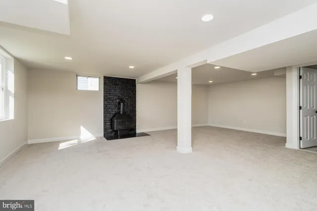 an empty room with closet and a window