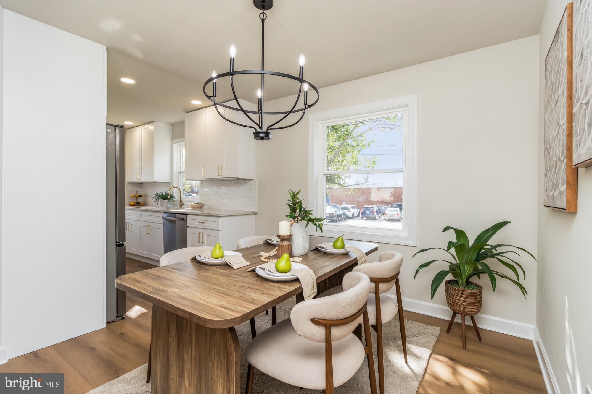 8016 Harris Avenue Parkville, MD 21234 - Photo 6 of 34 a view of a dining room with furniture window and wooden floor