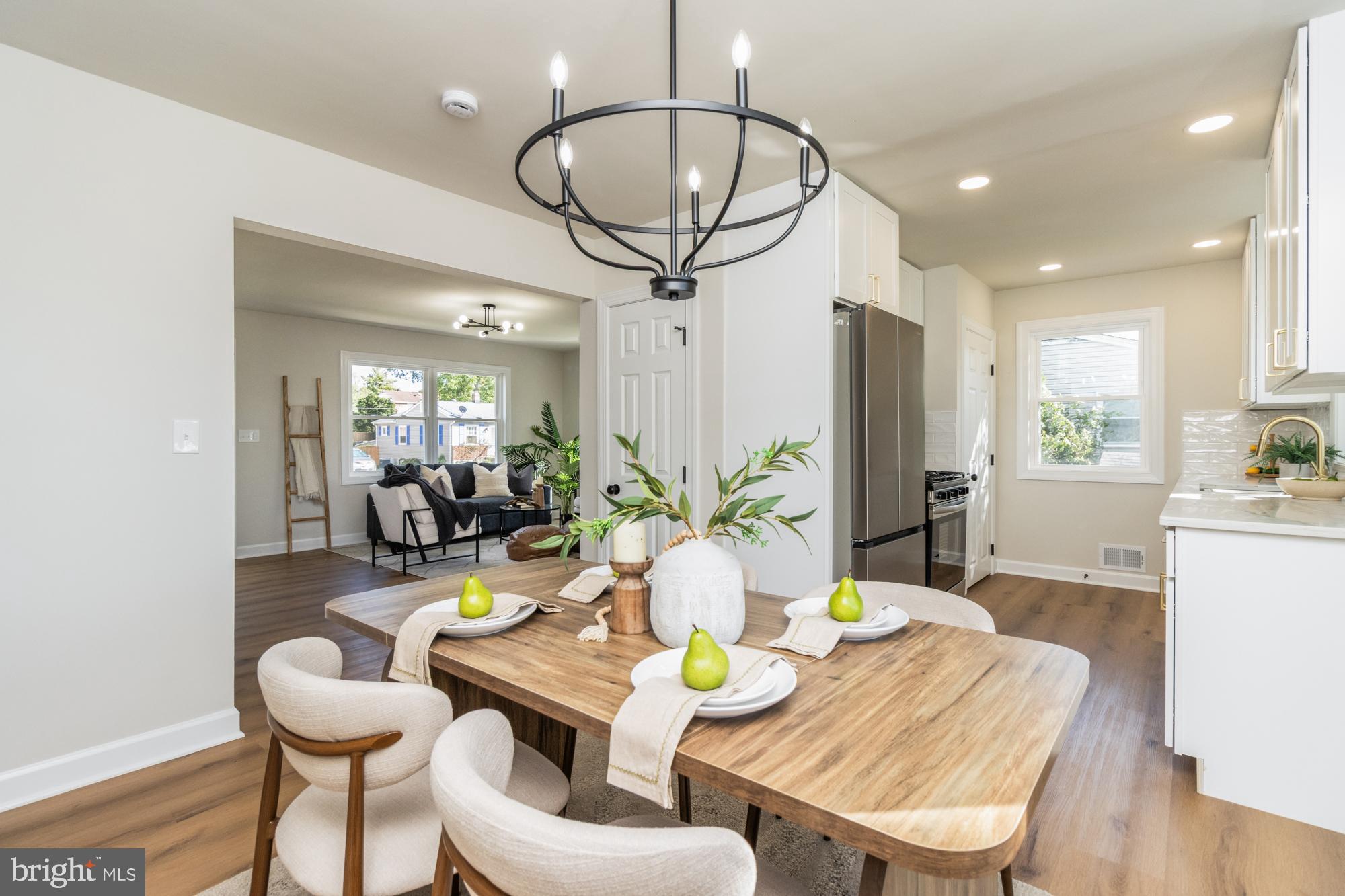 8016 Harris Avenue Parkville, MD 21234 - Photo 7 of 34 a view of a dining room with furniture and a chandelier