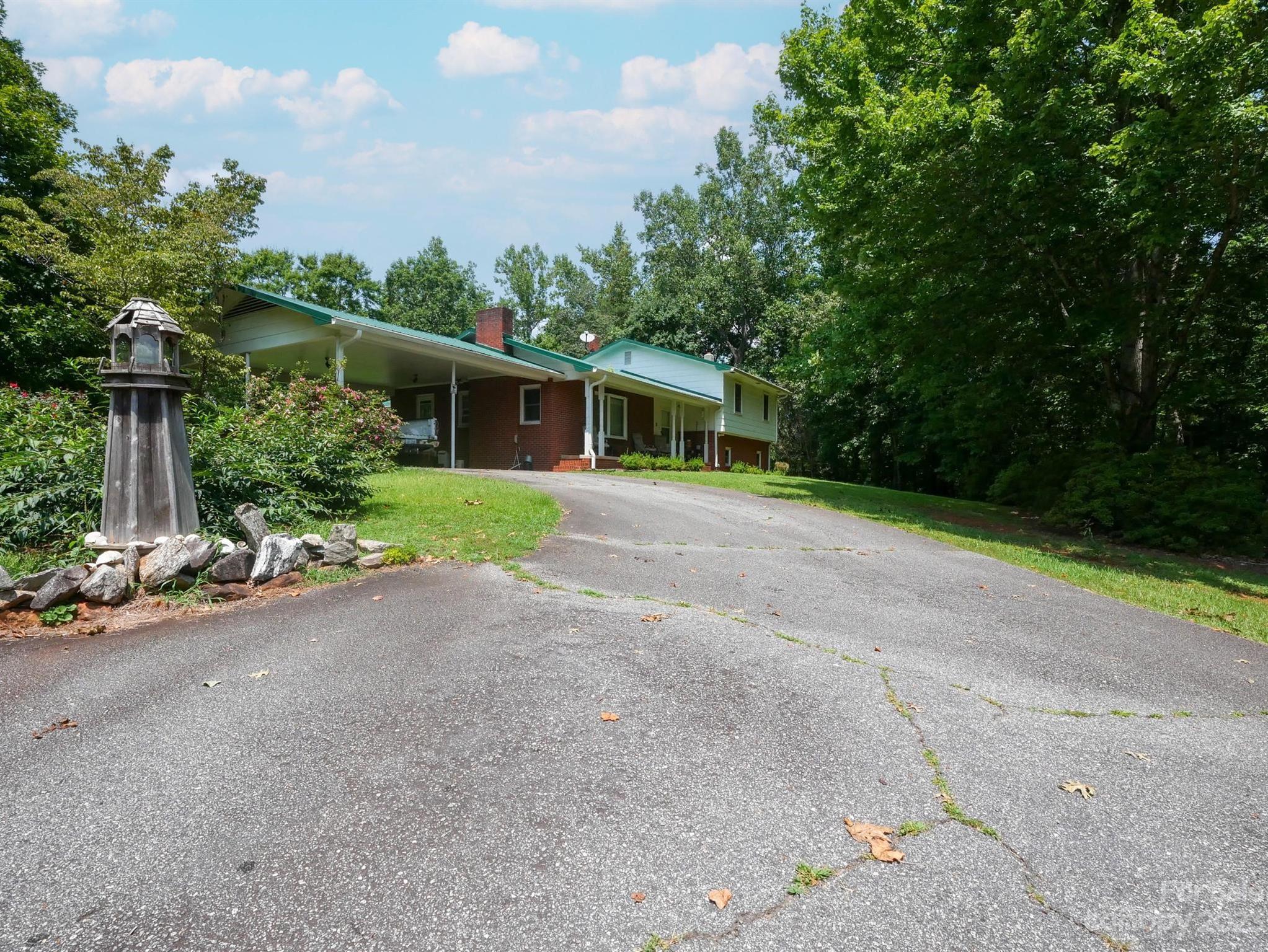 709 Green Road Rutherfordton, NC 28139 - Photo 14 of 46 a view of a house with backyard and garden